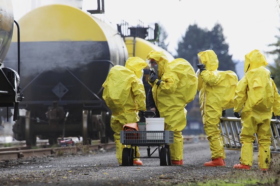Hazardous materials removal workers in protective gear