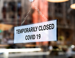 Graphic displaying a closed due to COVID19 sign in a store window